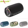 A collage of a portable Bluetooth speaker in different colors, with the main image showing a black speaker on a white background. Podgląd zdjęcia produktu