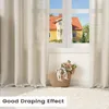 A window with curtains and a basket of flowers. Produktbild-Vorschau