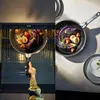 A split image showing a frying pan with food being placed into an oven on the left, and the same frying pan with food on a countertop on the right. Produktbild-Vorschau