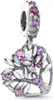 A close-up studio shot of a silver charm with pink and purple stones. Produktbild-Vorschau