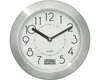 A close-up view of a round, silver-framed clock with a white face, black numbers, and black hands. It also displays a digital temperature reading. Anteprima dell’immagine prodotto