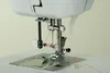 Close-up view of a sewing machine needle and thread. Produktbild-Vorschau