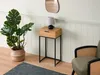 A narrow console table with a drawer and a lamp on top, placed next to a chair and a large potted plant. Produktbild-Vorschau