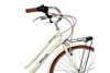 Close-up view of the front handlebars and front wheel of a cream-colored bicycle. Náhled obrázku produktu