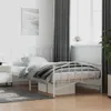A white metal bed frame with bedding in a room. Produktbild-Vorschau