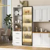 A white display cabinet with glass doors and shelves, filled with dishes and decorative items, in a room setting. Voir les images du produit