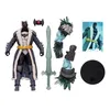 A collection of action figures and accessories, including a Batman figure in winter attire, a sword, and other character parts. Podgląd zdjęcia produktu