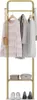 A gold coat rack with clothes and shoes on it. Produktbild-Vorschau