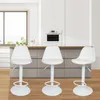Three white bar stools are arranged in a modern kitchen setting. Produktbild-Vorschau