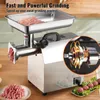 A stainless steel electric meat grinder with a tray of meat on top and ground meat in front, with an inset showing the motor mechanism. Produktbild-Vorschau