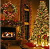 A cozy living room decorated for Christmas, featuring a fireplace, a Christmas tree, and festive decorations. Podgląd zdjęcia produktu