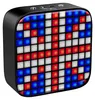 A close-up shot of a black Bluetooth speaker with a grid of red, white, and blue lights displayed on its front. Voir les images du produit