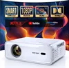 A white projector is shown in the foreground with a colorful, abstract background featuring app logos and feature highlights. Produktbild-Vorschau