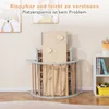 A children's climbing toy is shown folded and stored in a room with artwork on the wall and a shelf with books and toys. Voir les images du produit