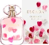 A bottle of Escada Celebrate N.O.W. Eau de Parfum for Women and its packaging, decorated with pink and white petals. Produktbild-Vorschau