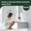 A mother and baby in a modern bathroom, with a toilet in the foreground. Produktbild-Vorschau