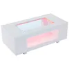 A white coffee table with a glass top and LED lighting is shown against a white background. Voir les images du produit