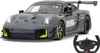 A remote-controlled Porsche 911 GT2 RS Clubsport 25 car and its steering wheel controller are displayed against a white background. Podgląd zdjęcia produktu