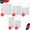 A collage of different sizes of white metal access panels, displayed over a blueprint background. Podgląd zdjęcia produktu