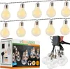 A string of solar-powered LED light bulbs and a box of the product. Anteprima dell’immagine prodotto