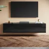 A modern living room with a wall-mounted TV cabinet and a large television. Voir les images du produit