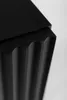 A close-up shot of the fluted side of a black cabinet. Náhľad obrázku produktu