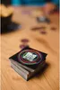 A stack of cards with QR codes on a wooden table. Produktbild-Vorschau