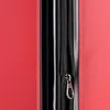 A close-up view of a red suitcase zipper. Produktbild-Vorschau
