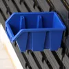 A blue plastic sorting box is attached to a black rack. Anteprima dell’immagine prodotto