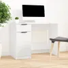 A white desk with a computer monitor and a plant on it, with a chair in front of it. Podgląd zdjęcia produktu