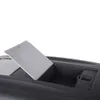 A close-up view of the top of a dark gray pet carrier with a light gray lid open, revealing a storage compartment. Podgląd zdjęcia produktu