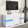 A modern white sideboard with blue LED lighting is displayed in a living room setting with a television mounted on the wall above it. Podgląd zdjęcia produktu