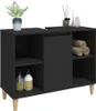 A black bathroom vanity cabinet with wooden legs, shown with decorative items and towels on top and inside. Náhled obrázku produktu