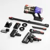 A collection of vacuum cleaner parts and accessories laid out on a white background. Produktbild-Vorschau