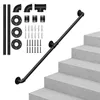A black metal handrail kit is displayed on a set of concrete stairs against a white background. Produktbild-Vorschau