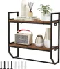 A two-tiered industrial-style wall shelf with decorative items. Produktbild-Vorschau