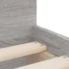 Close-up view of wooden bed slats and grey wood-effect material. Produktbild-Vorschau