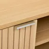 Close-up of a wooden cabinet with a ribbed drawer front and a gray handle. Produktbild-Vorschau