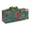 A green storage bag for a Christmas tree, with red handles and trim. Some of the tree branches are visible sticking out of the top. Produktbild-Vorschau