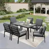 An outdoor patio setting with a dining set and a gazebo in the background. Produktbild-Vorschau