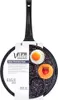 A frying pan with multiple egg-shaped indentations, showing a fried egg and a peach with a strawberry in it. Anteprima dell’immagine prodotto