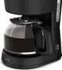 A close-up shot of a black coffee maker with a glass carafe filled with coffee. Produktbild-Vorschau