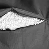 A close-up view of a dark gray fabric with a zipper partially open, revealing white filling material. Produktbild-Vorschau