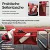 A close-up of a red lounge chair with a side pocket holding a phone and a water bottle. Produktbild-Vorschau