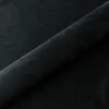 A close-up, angled view of a black fabric, likely a bed frame or mattress. Produktbild-Vorschau