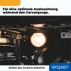 Interior of an oven with the light on, showing racks and the oven door mechanism. Produktbild-Vorschau
