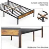 Close-up views of a metal bed frame with wood-effect accents, highlighting its construction and stability. Voir les images du produit