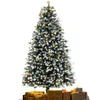 A decorated artificial Christmas tree with presents underneath. Produktbild-Vorschau