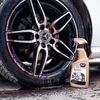 A car wheel with brake dust and a cleaning spray bottle. Náhled obrázku produktu