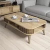 A light oak coffee table with a lower shelf, set in a living room with a couch and TV stand. Anteprima dell’immagine prodotto
